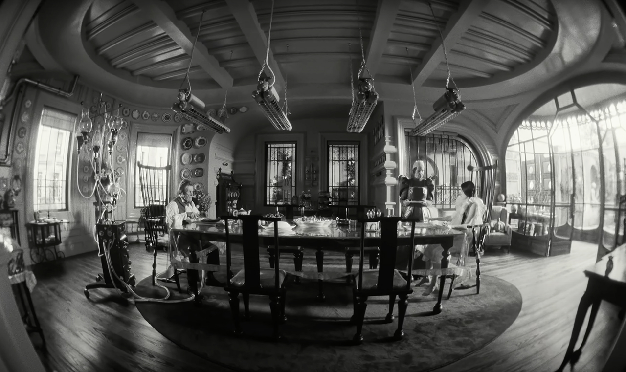 Lens Distortion in Poor Things (2023) (curved dining room)
